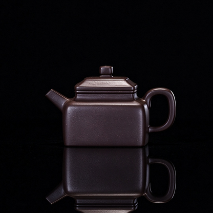 Yixing original ore Zini square teapot with 130ml capacity and handmade construction from Huanglong Mountain clay