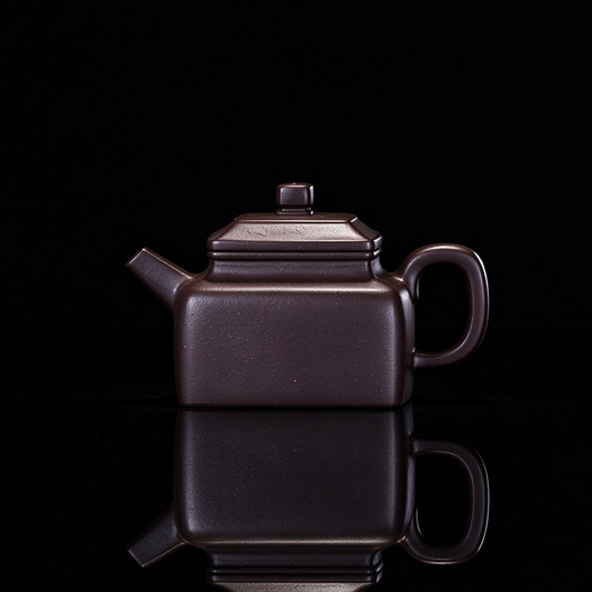 Yixing original ore Zini square teapot with 130ml capacity and handmade construction from Huanglong Mountain clay
