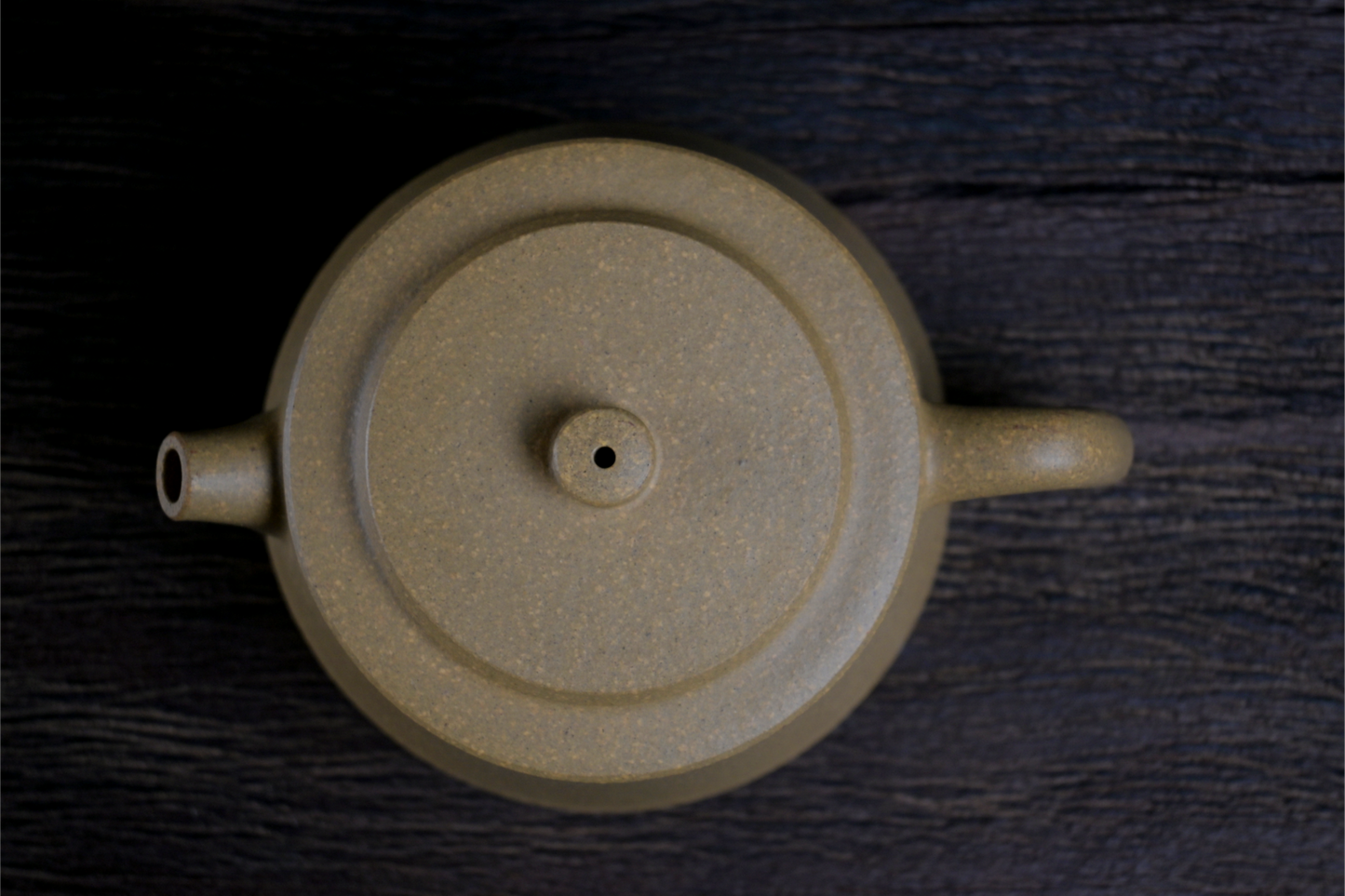 Han-style influenced teapot with modified proportions, featuring yellow Duan clay's natural grainy feel