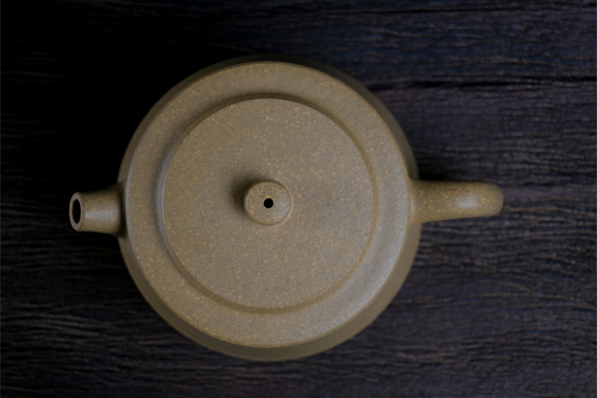 Han-style influenced teapot with modified proportions, featuring yellow Duan clay's natural grainy feel