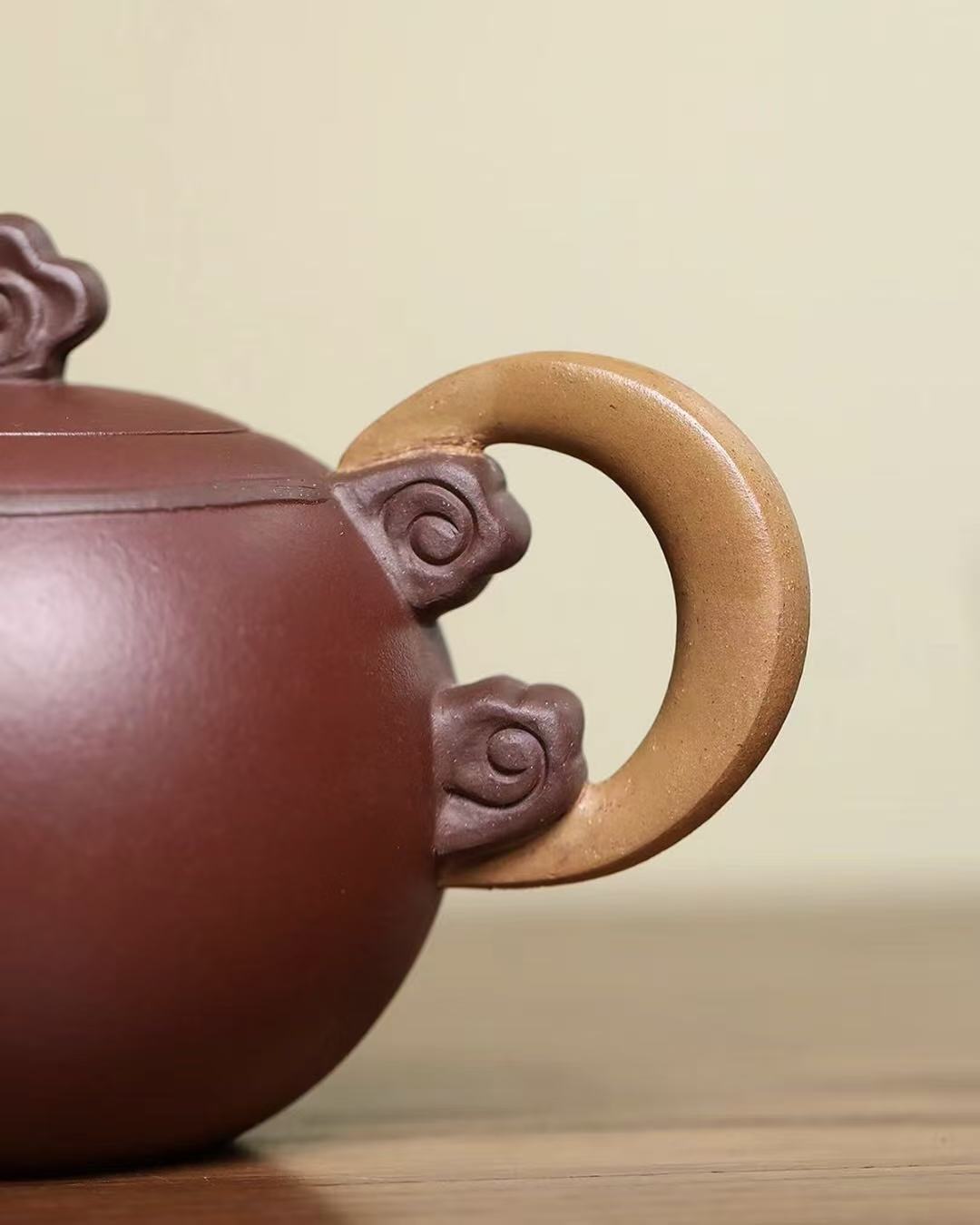 Elegant Yixing teapot with hand-carved lunar and cloud patterns