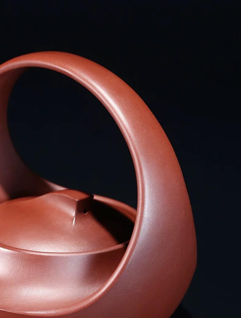 Handcrafted Qu Pot reproduction by master Yang Junbao, maintaining original color and line accuracy in pure purple clay