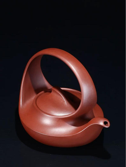 Museum-quality Qu Pot replica by Yang Junbao, recreating the flowing spiral lines of the original award-winning teapot