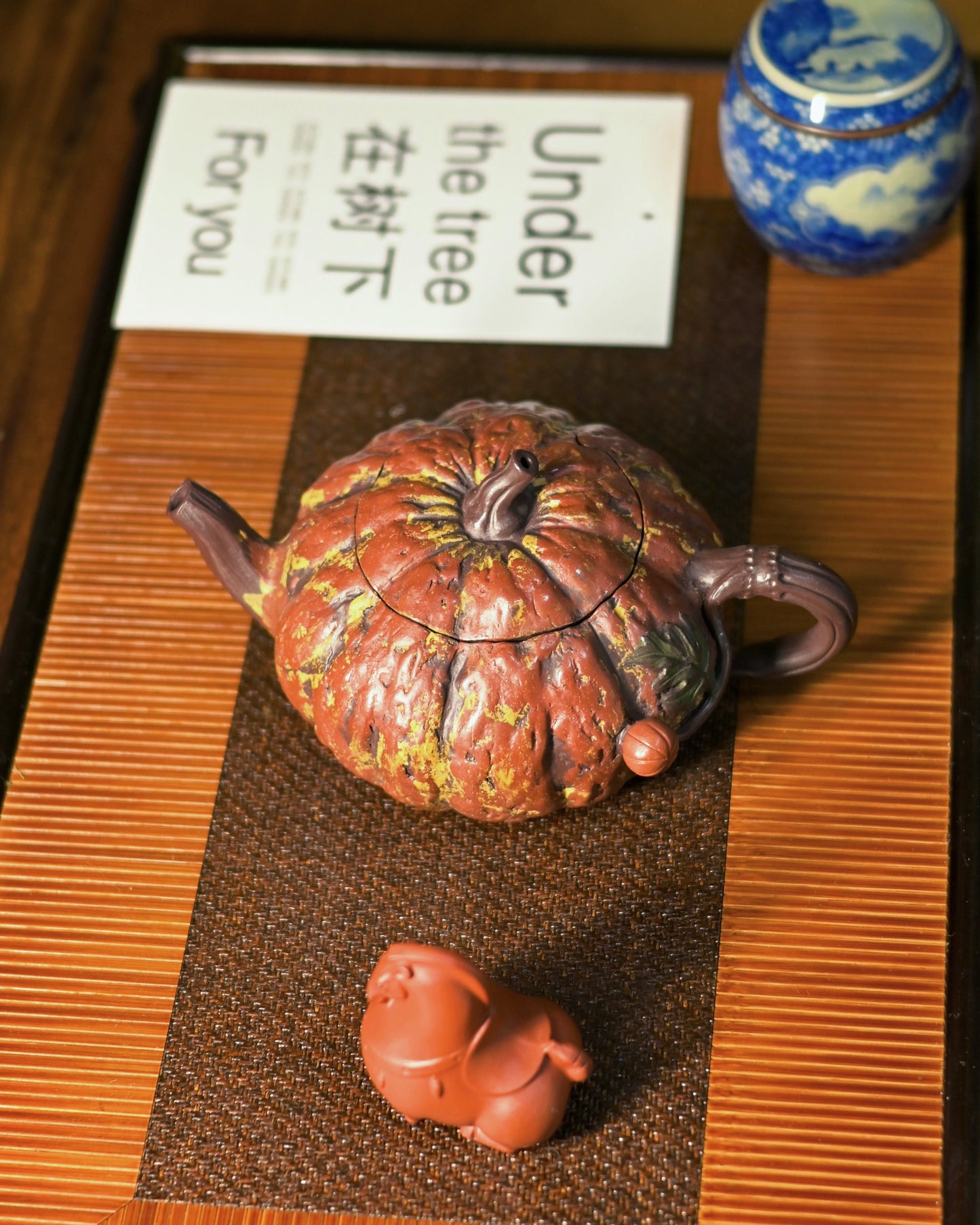 Seven-hole or ball filter at spout base preventing leaf fragments while allowing smooth tea pour