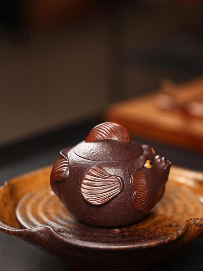 Traditional Yixing zisha techniques meet playful pufferfish design in this fully handcrafted teapot with modern functionality.