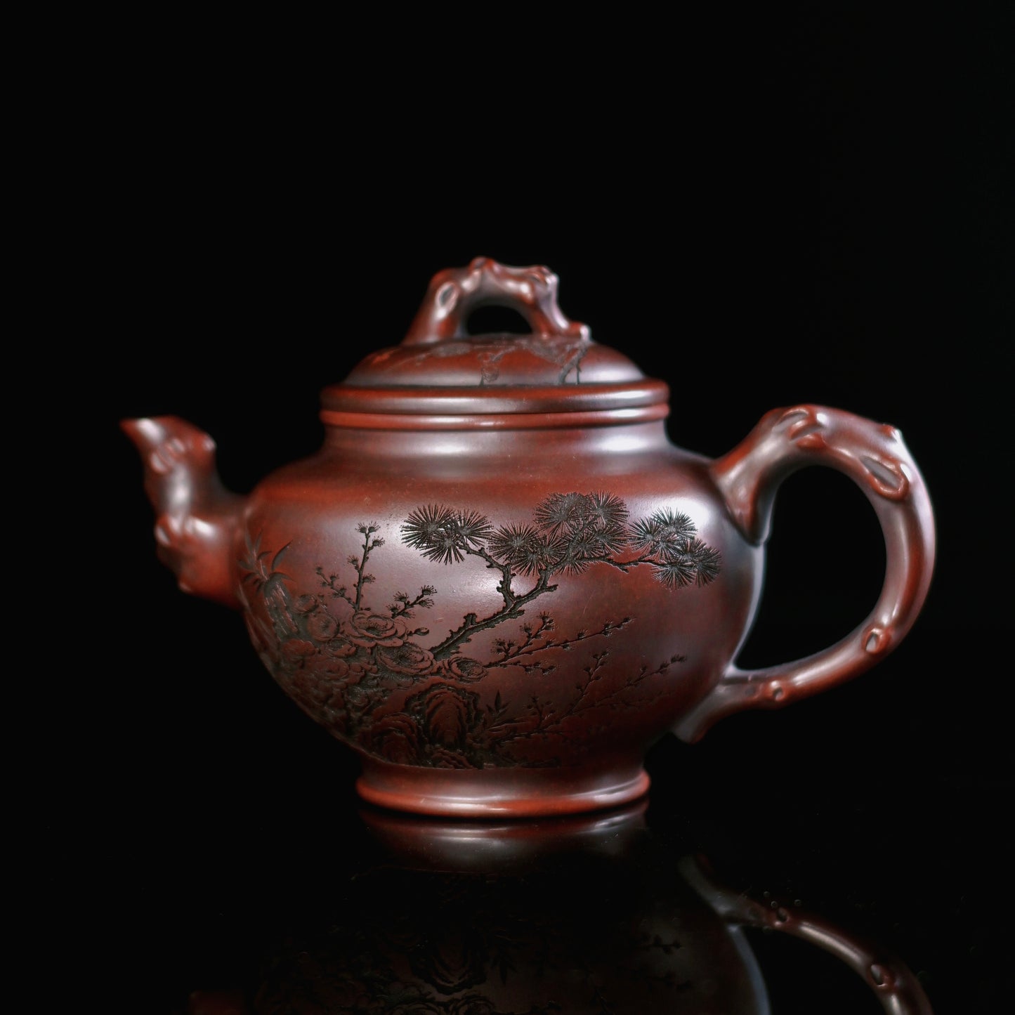 Yixing "Smiling Cherry" dark clay teapot showing classic Ming Dynasty form with modern capacity