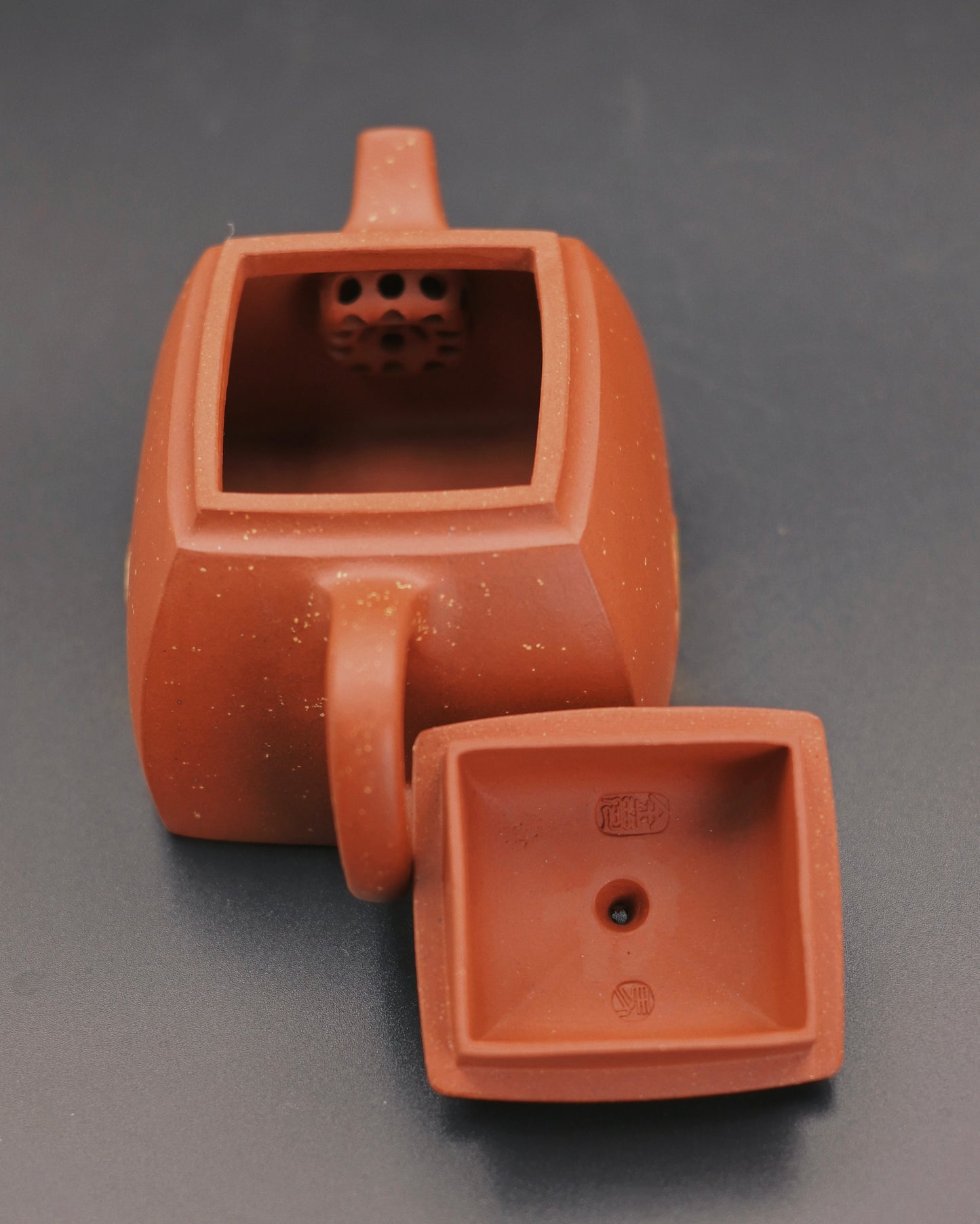 Detail of carved Buddha motif on Yixing clay teapot