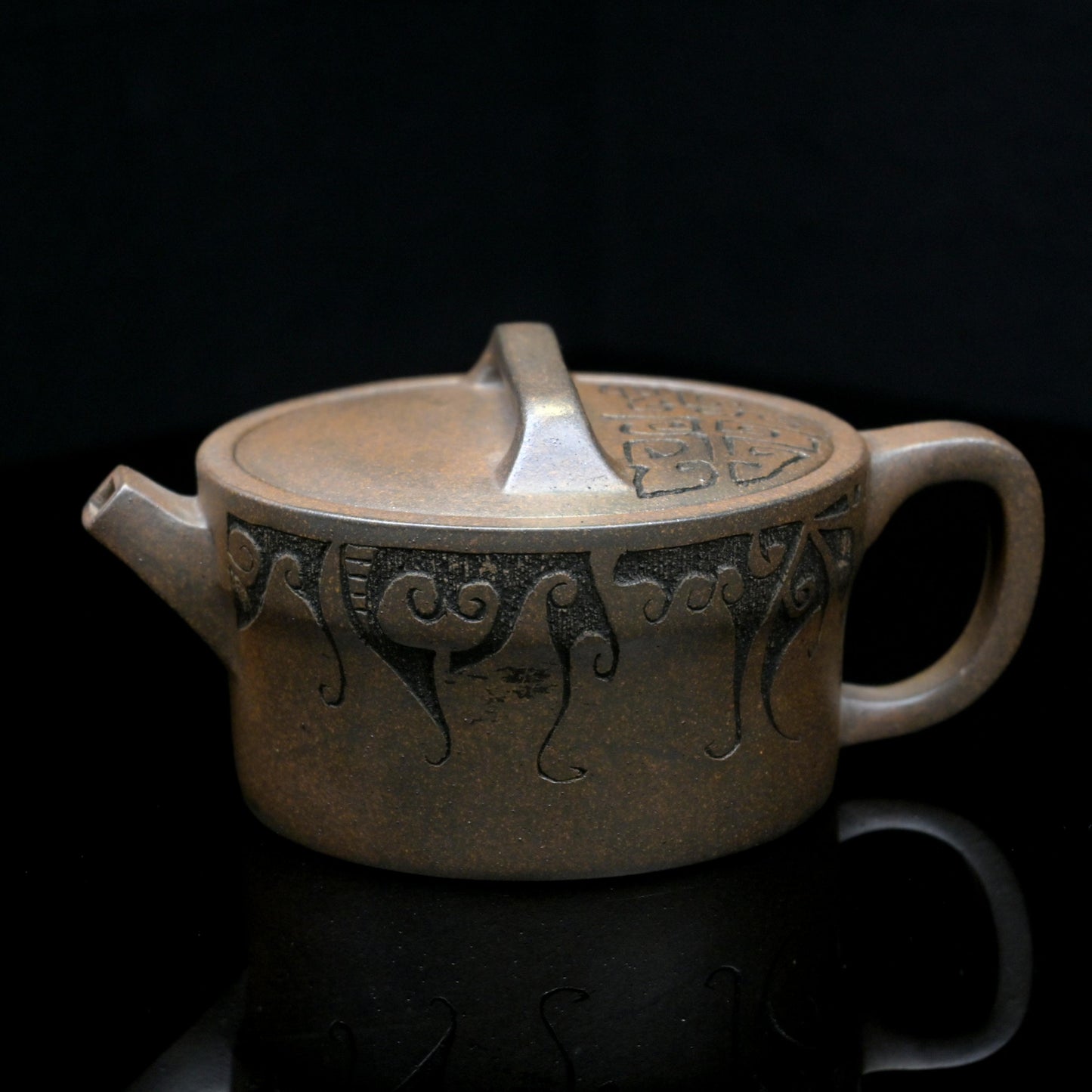 Yixing wood-fired purple clay teapot handcrafted from original ore Duan clay, featuring Han-style design and natural ash glaze