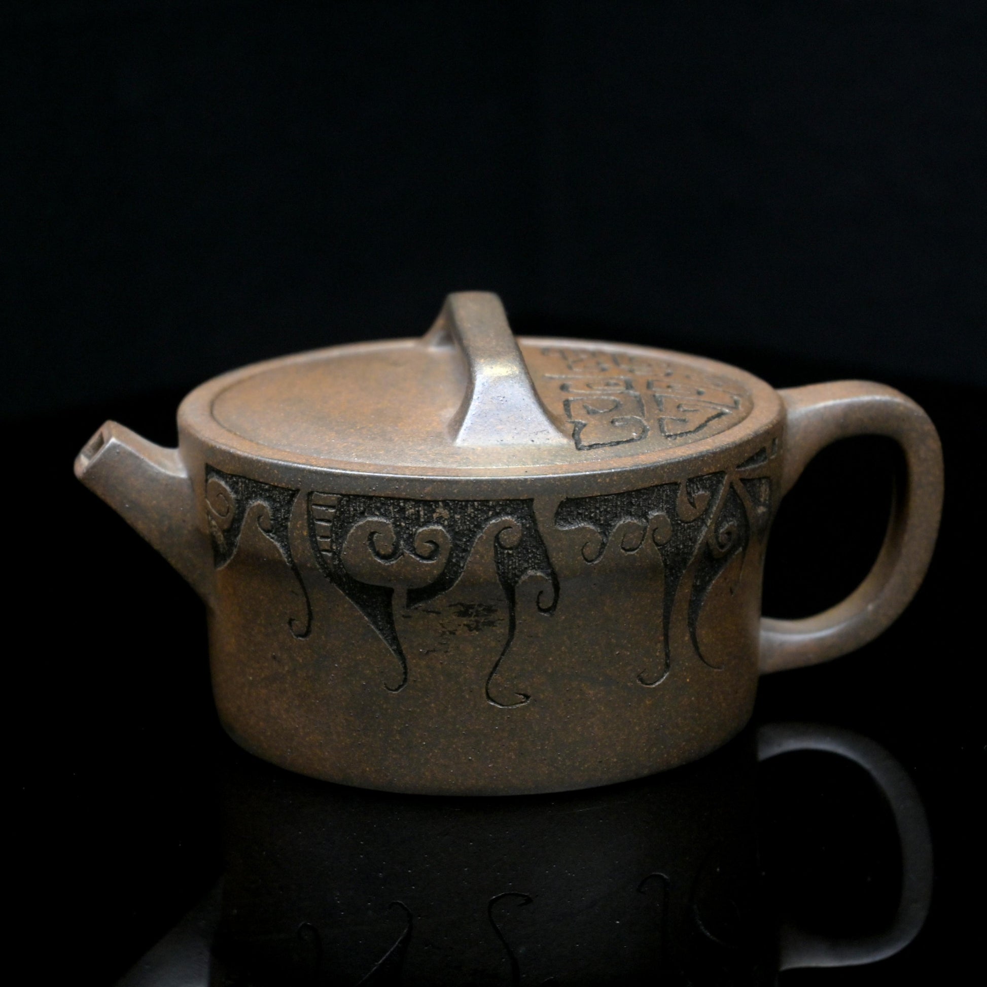 Yixing wood-fired purple clay teapot handcrafted from original ore Duan clay, featuring Han-style design and natural ash glaze
