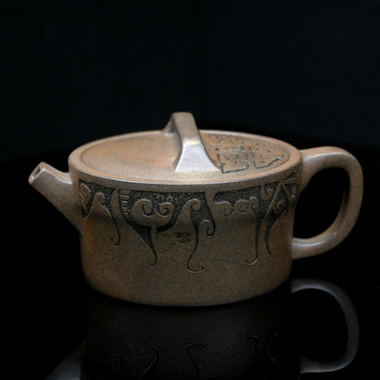 Yixing wood-fired purple clay teapot handcrafted from original ore Duan clay, featuring Han-style design and natural ash glaze