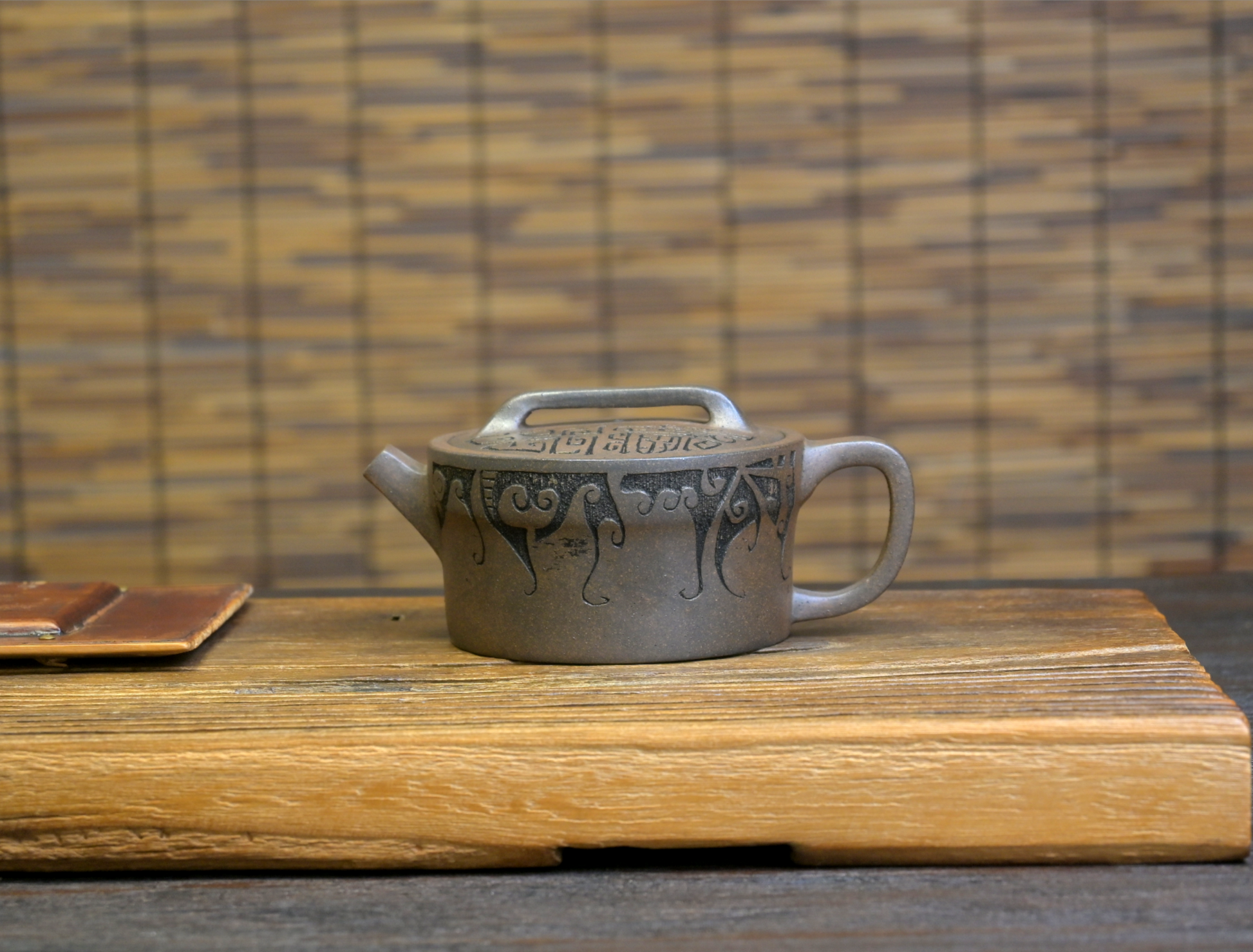 "Wood kiln fired Yixing purple clay teapot with light ash glaze and rustic appearance, made from authentic Duan clay