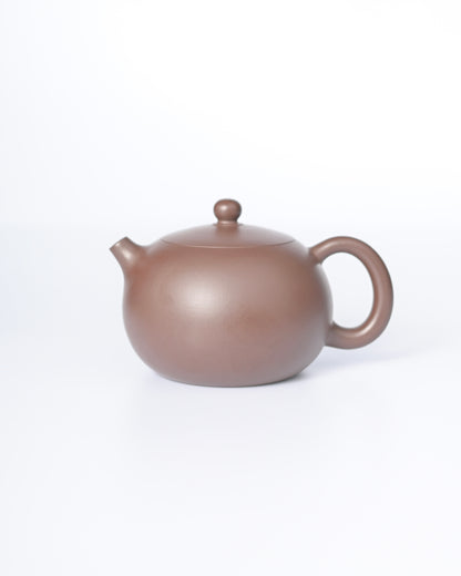 Handcrafted Yixing zisha Xishi teapot in authentic purple clay (zini) - one of the 10 most revered traditional shapes, delivering flawless pouring and timeless curves for oolong and pu'erh teas.