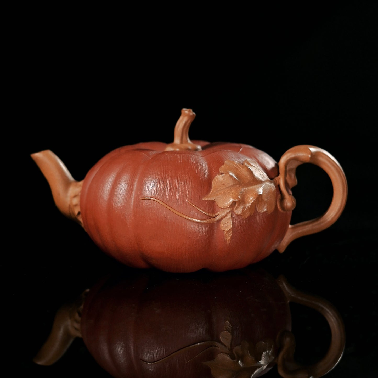 Yixing Zisha clay pumpkin teapot showing natural gourd-inspired form and handmade shaping