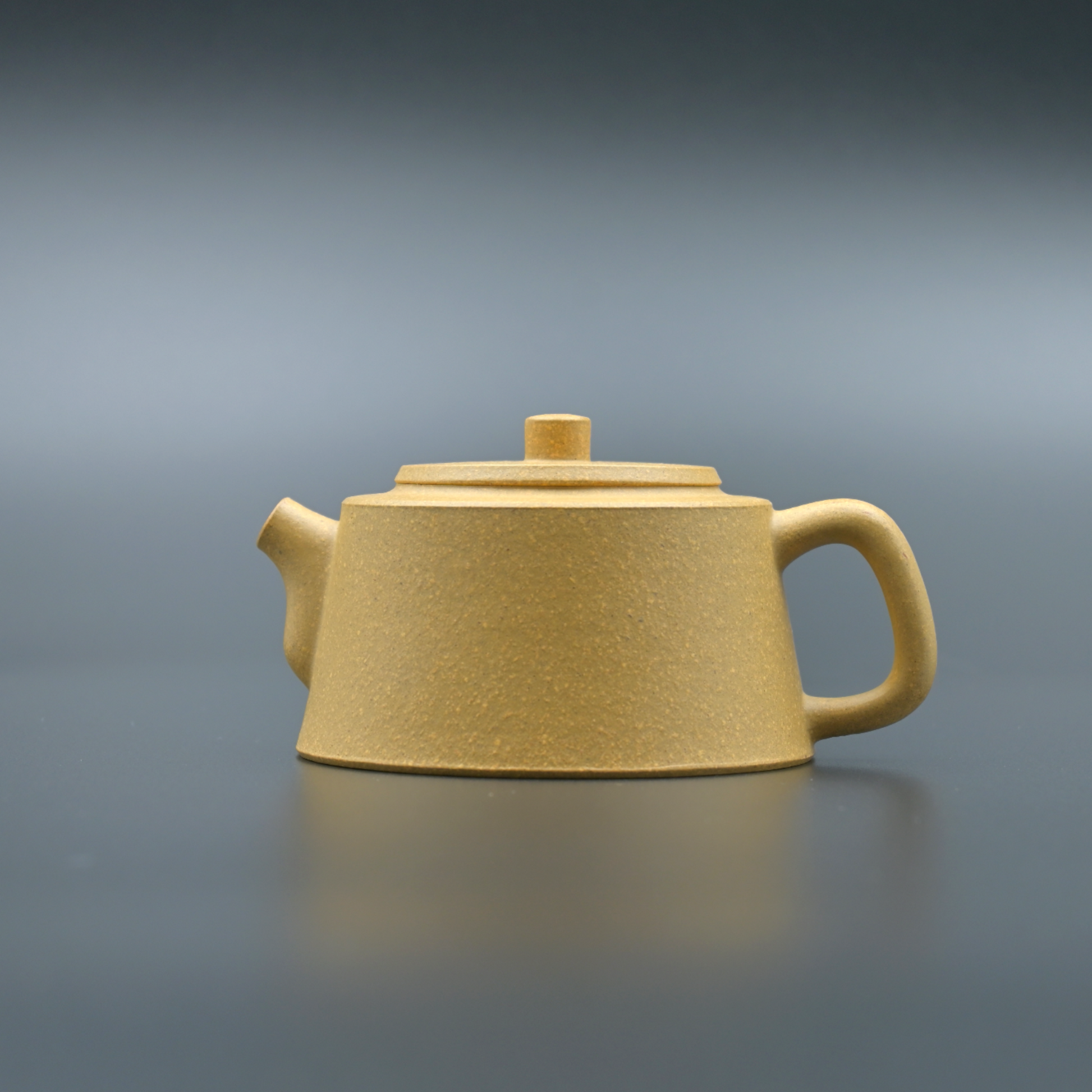 Yixing Zisha yellow Duan clay Pillar Base teapot with unique wide base design inspired by ancient column foundations