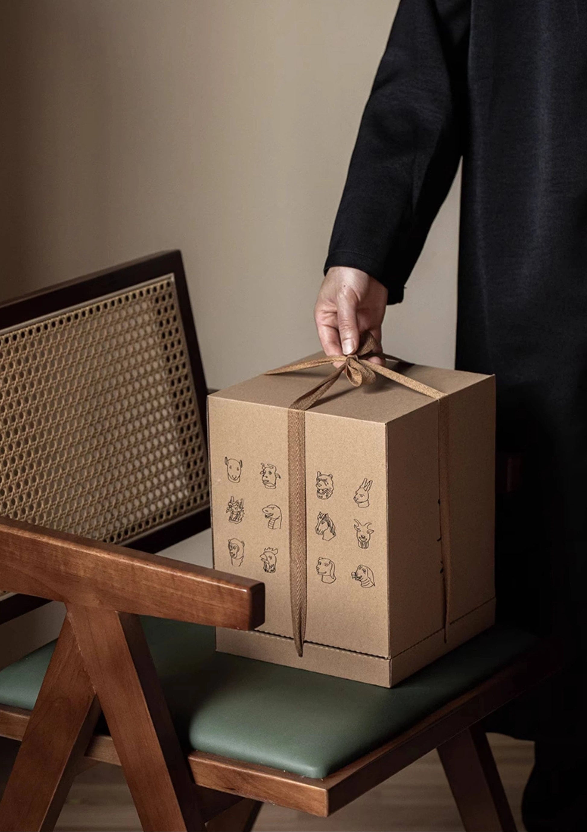 Rustic brown ceramic tea jar with zodiac top