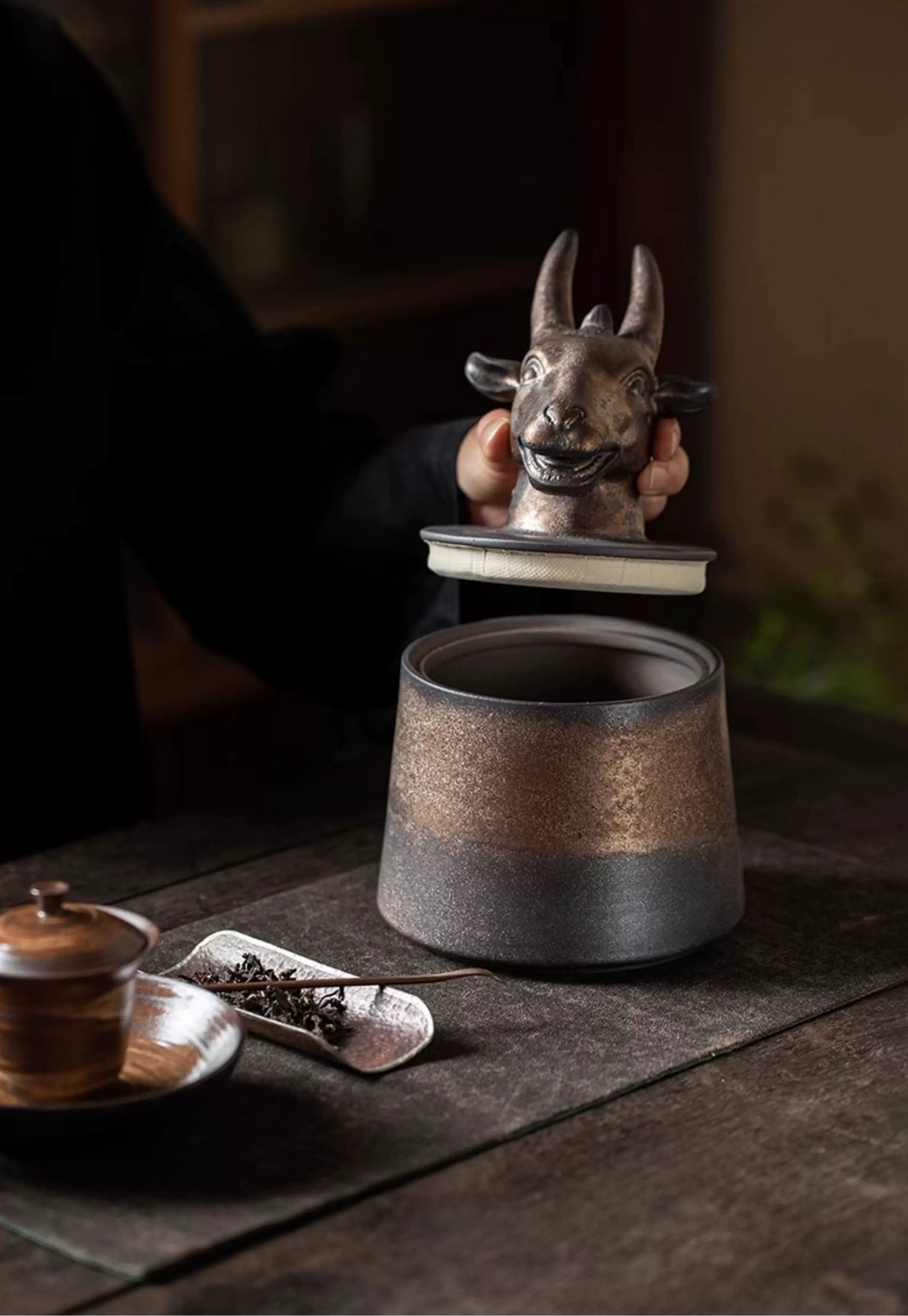 Handmade zodiac tea storage jar in dark iron glaze